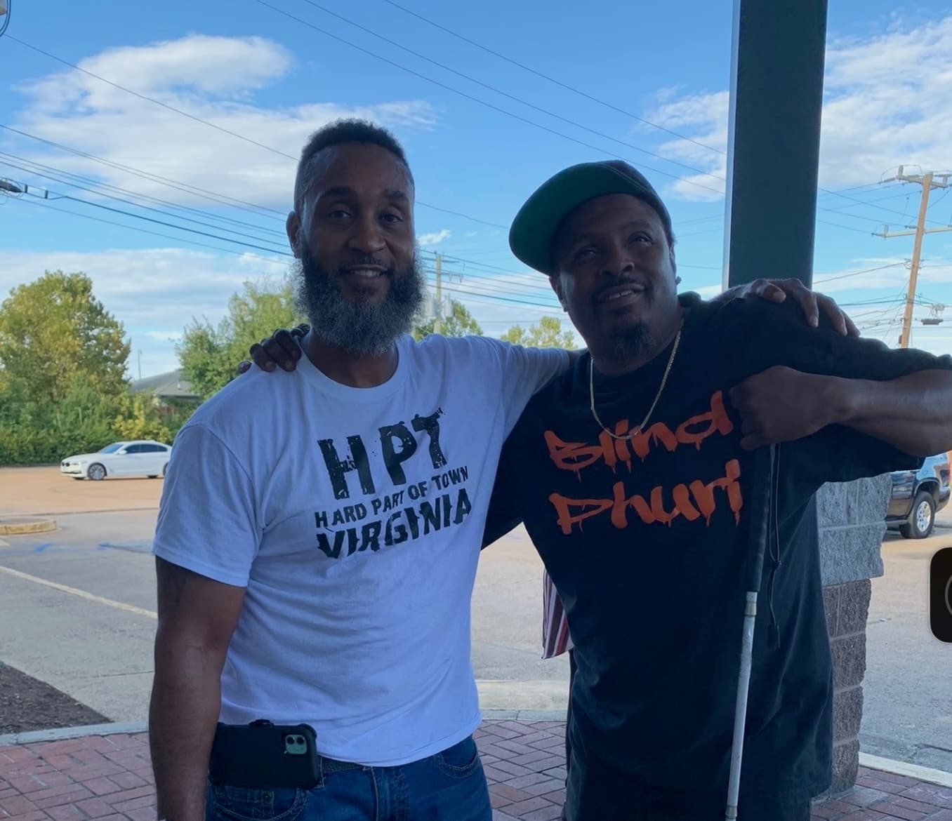 Andrew with comedian Blind Phuri, sharing a joyful moment