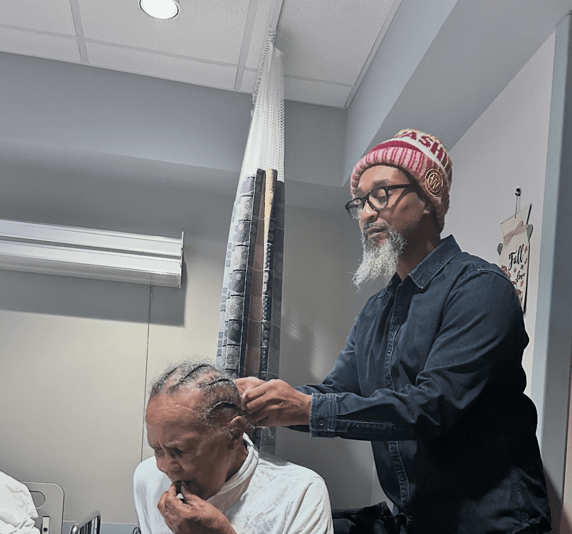 Andrew braids Grandma Hallie's hair at home